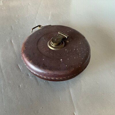 Vintage leather-bound tape measure-image