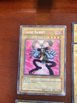 YU GI OH CARDS (8)-DAR RABBIT/BLUE EYES WHT DRAG/DARK MAGICIAN/RED E DRAG/WING -image